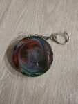 Black Red Green Cosmic Round Resin Keychain
